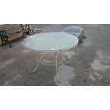 Glass top wrought iron garden table