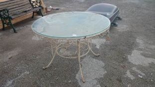 Glass top wrought iron garden table