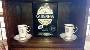 A limited edition Guiness bottle & glass set & 2 Guiness cups & saucers