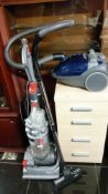 A Dyson vacuum cleaner & 2 other vacuum cleaners