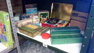 A mixed lot of tins & retro travelling irons etc.