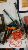 A hedge trimmer & quantity of lawn mower power leads