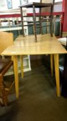 A small drop leaf kitchen table