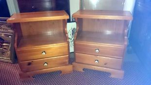 A pair of 2 drawer bedside cabinets