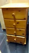 A pine 4 drawer bedside chest