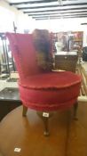 A little red velour bedroom chair