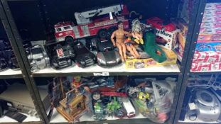 A quantity of boys toys including Action man & remote control cars etc. (2 shelves)