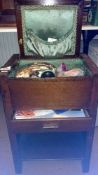 A sewing cabinet & contents