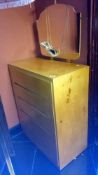 A 5 drawer chest with mirror