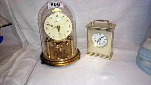 A carriage clock under dome & 1 other