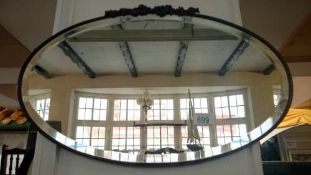 A vintage decorative bevel edged mirror