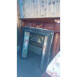 Reproduction cast iron fireplace with teak effect surround