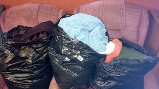 3 bags of blankets, coats & towels etc.