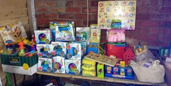 A quantity of children's toys including puzzles, fountain gardens & wooden stacking trains etc.