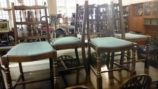 A set of 4 spindle back dining chairs