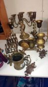 A mixed lot of brass and silver plate including candelabra, candlesticks, goblets etc
