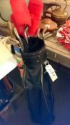 A golf bag and golf clubs