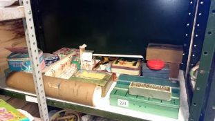 A shelf of boxes, tins etc