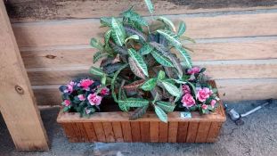 A wooden garden trough