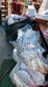 A large quantity of clothing, bedlinen etc