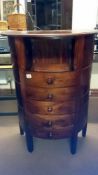 A D shaped mahogany chest with top drawer missing