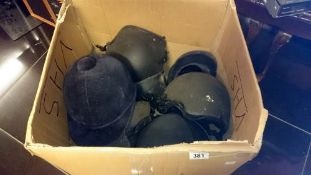 A box of riding hats