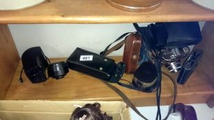 A Voightlander camera, Agfa folding camera etc
