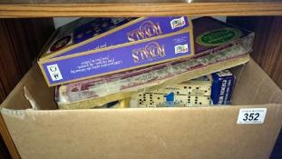 A box of playing cards, jigsaw puzzles etc