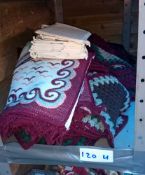 A shelf of crocheted blanket squares