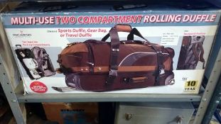 A boxed multi rolling duffle bag