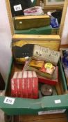 A box of old tins etc