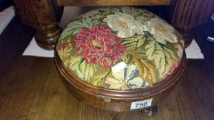 A Victorian foot stool with tapestry top