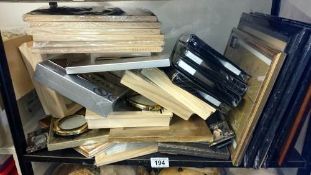 A shelf of assorted photo frames