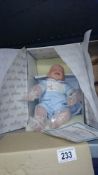 An Ashton Drake limited edition baby doll