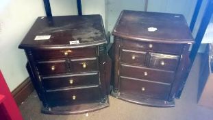 A pair of bedside cabinets