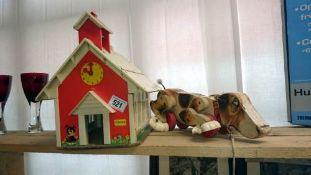 A pull along basset hound toy and a toy school