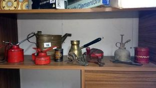 A quantity of vintage oil cans etc