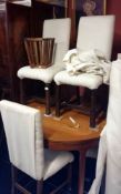 A set of 4 dining chairs and a planter