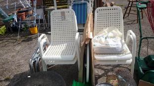 A garden table, 4 chairs & 2 folding chairs