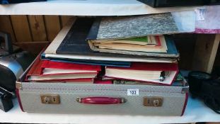 A suitcase of albums containing photo's