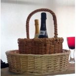 2 baskets and 2 bottles of sparkling wine