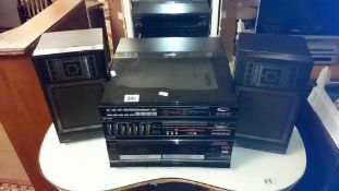 A Sanyo stereo system and speakers