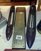 2 shuttles and 2 brass topped cribbage boards
