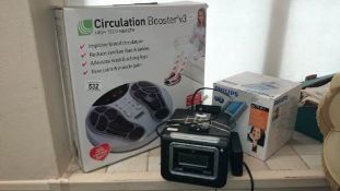 A boxed circulation booster and 2 other items