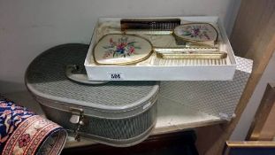 A vanity case and a boxed dressing table set