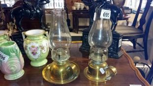 A pair of brass hand oil lamps