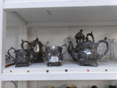 An old pewter tea set on tray