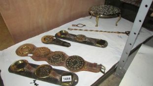 A Victorian brass trivet and 4 martingales with brasses