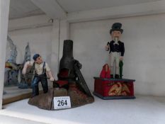 A cast iron mechanical Uncle Sam money box and a cast iron mechanical blacksmith money box