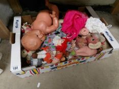 A box of dolls and soft toys
